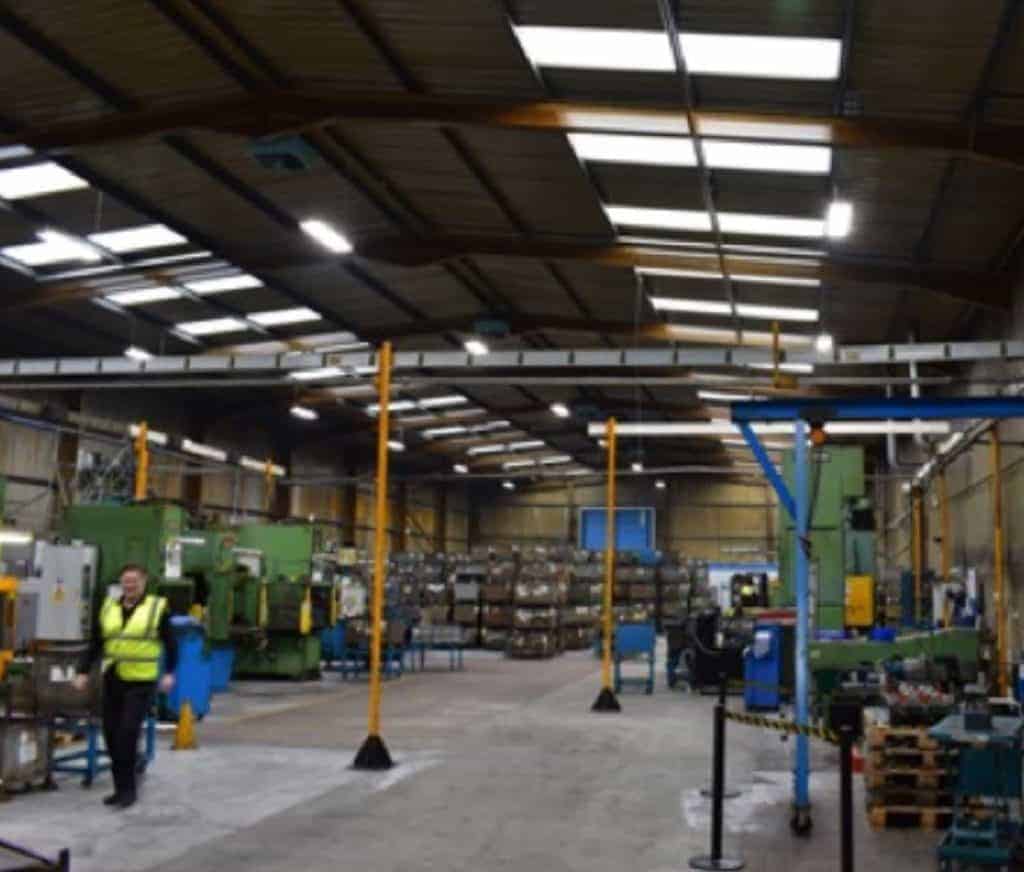 man with hi vis in voestalpine warehouse