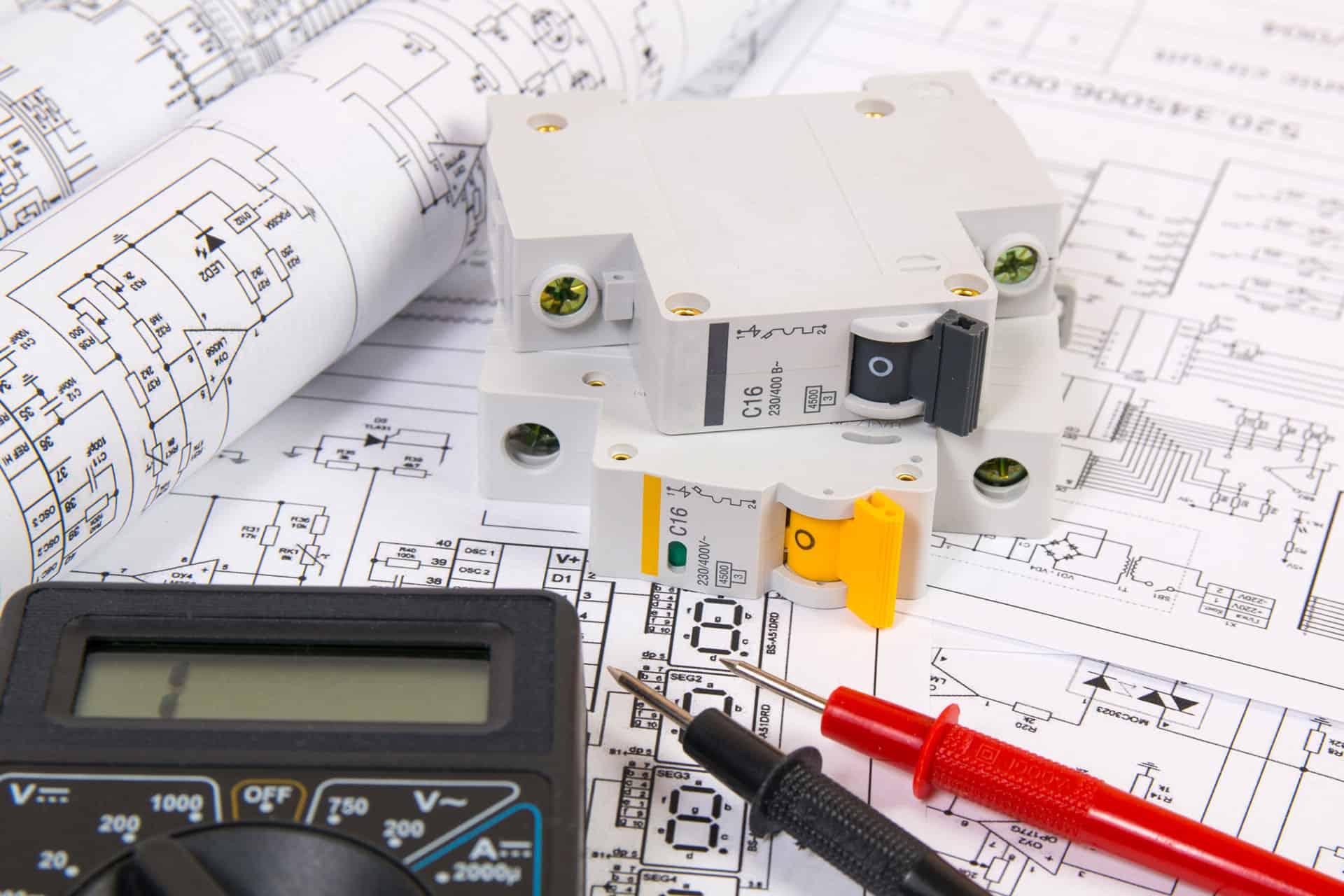 electrical engineering drawings, modular circuit breaker and digital multimeter. electrical network protection and switching.