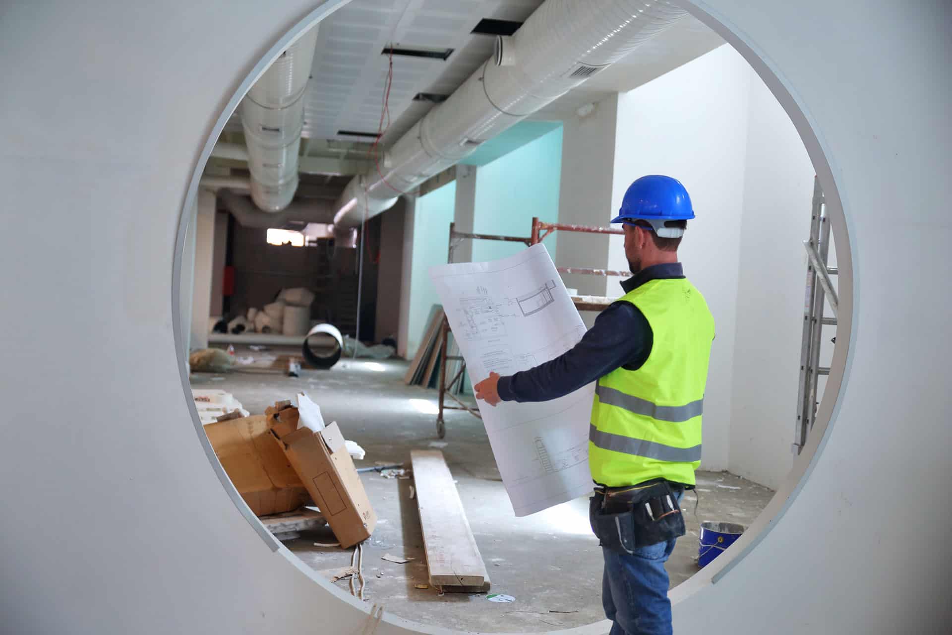 man holding blueprints - ventilation system